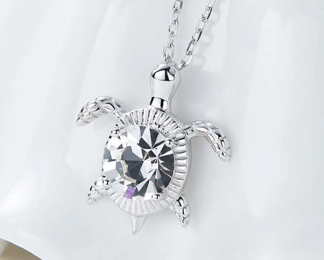 Sterling silver swimming white crystal turtle necklace